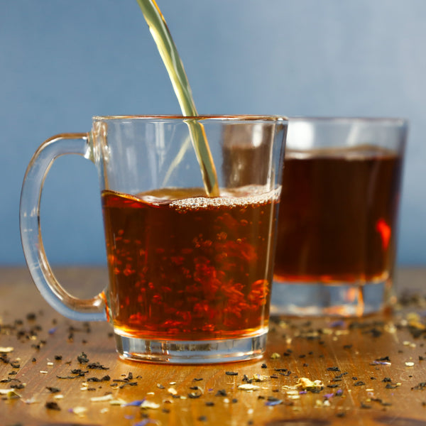 Brewed Blackberry Sage being poured into glass.