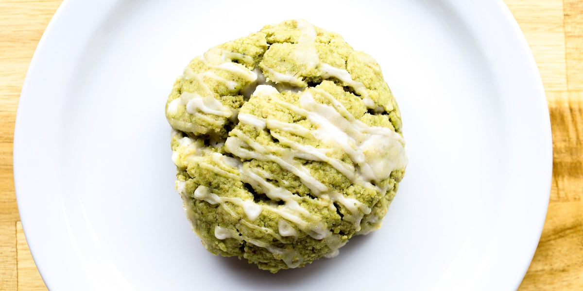 Matcha white chocolate chip scone in middle of plate