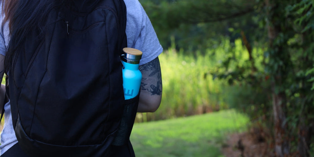 tea flask in backpack walking outside