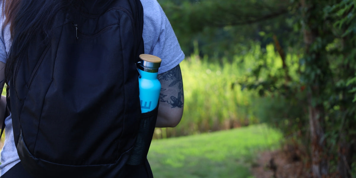 tea flask in backpack walking outside