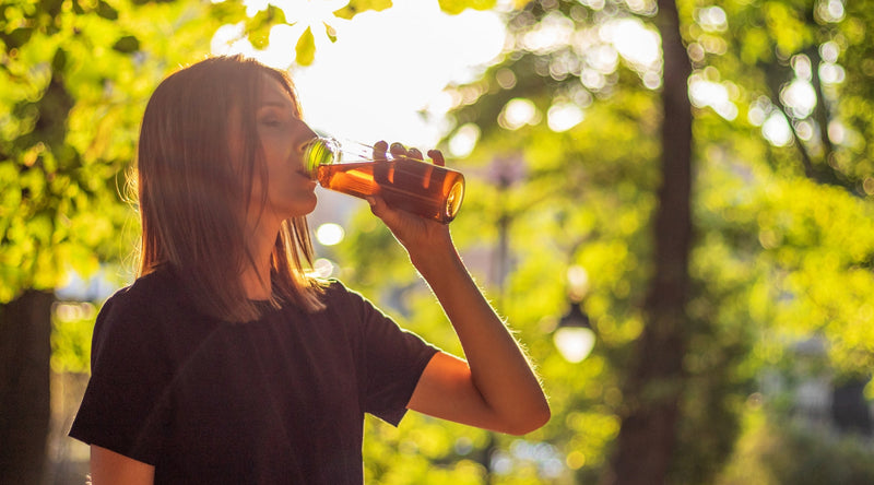 Woman drinking iced tea