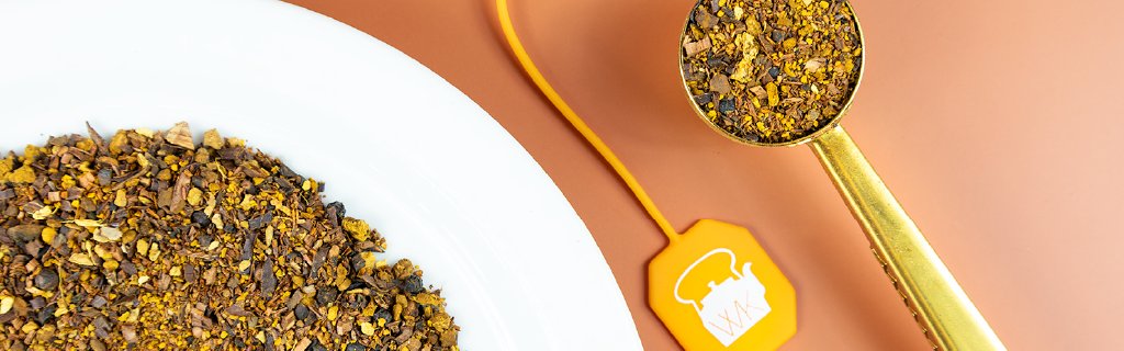 Chaga tea next to a tea scoop.