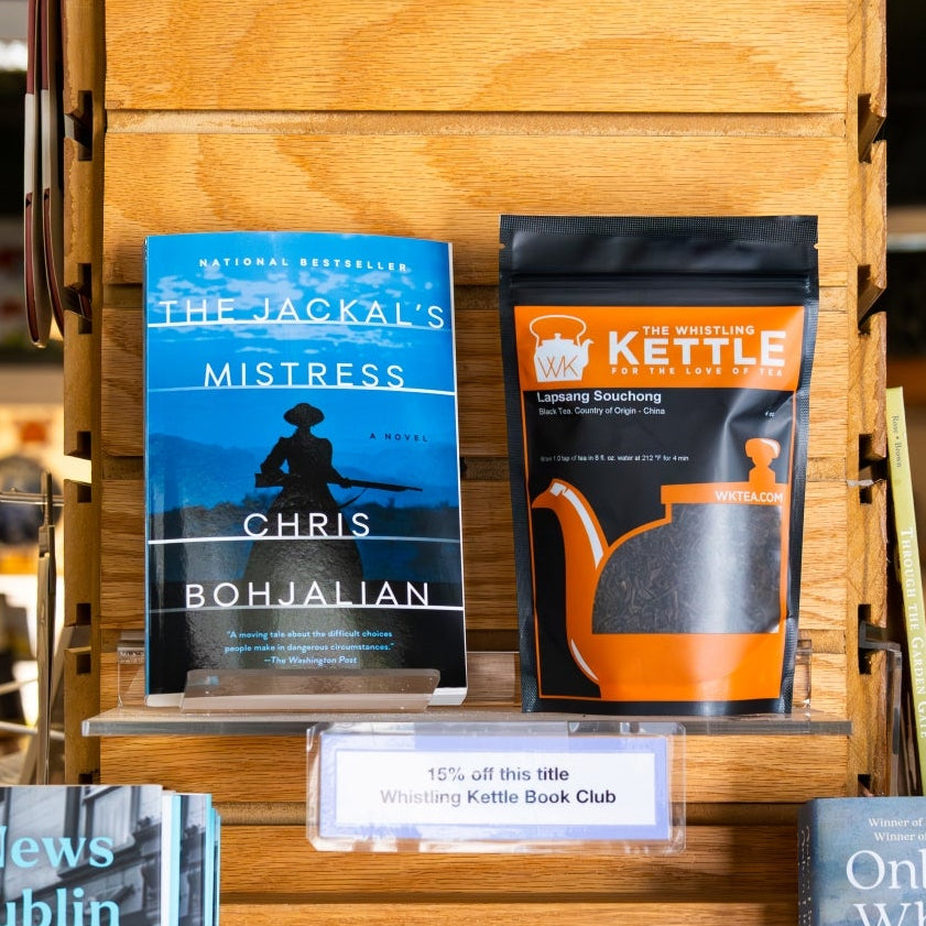 The Jackal's Mistress novel by chris bohjalian next to a 4oz bag of loose leaf lapsang souchong