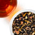Overhead view of Caramel Toffee black tea with petals and toffee pieces