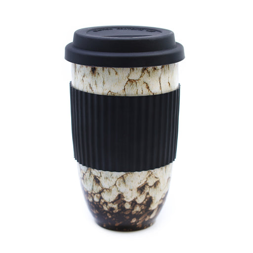 White Bird's Egg ceramic travel mug with black silicone sleeve and reusable lid on a white background