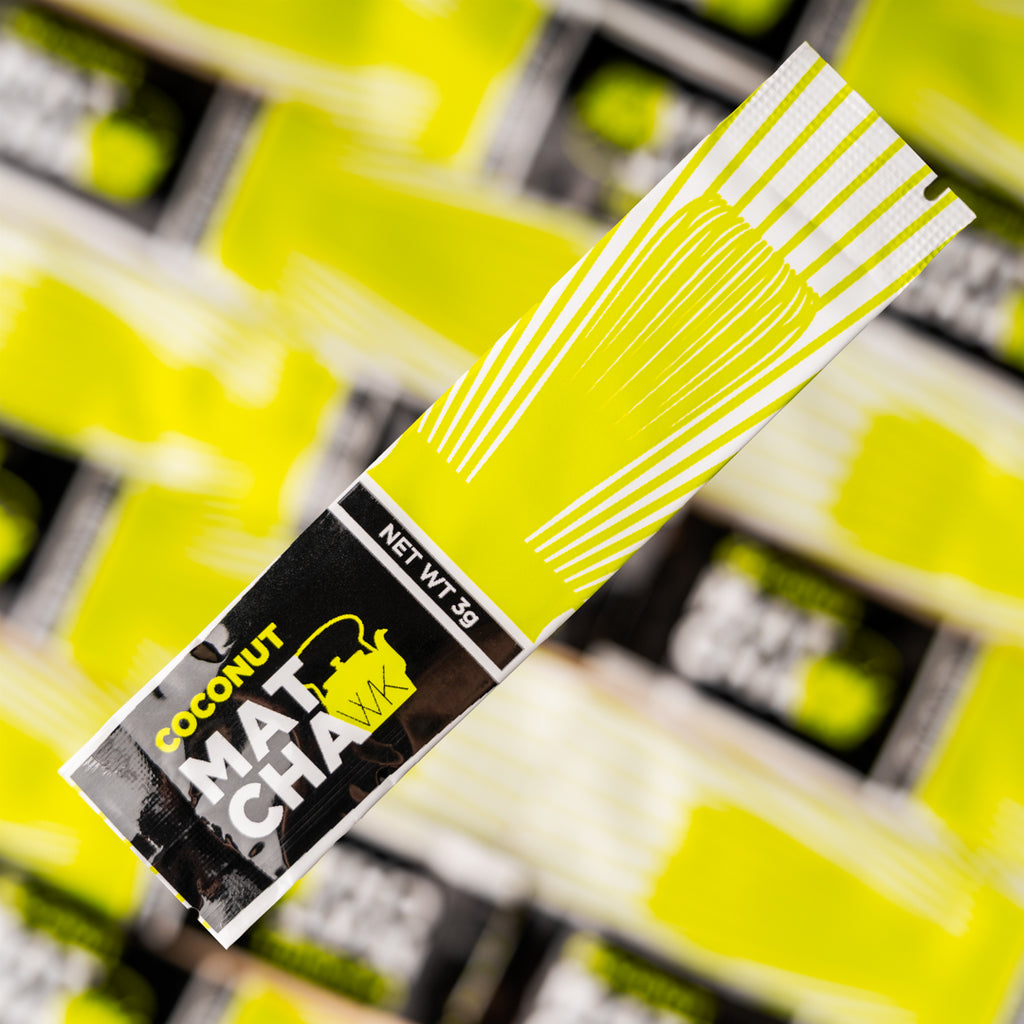 Individual 3-gram Coconut Matcha stick pack with light green, white, and black branding, featuring The Whistling Kettle logo and a bamboo whisk illustration on a white background