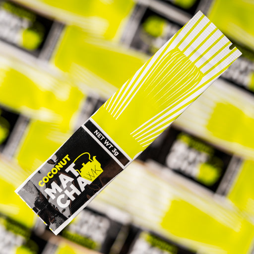 Individual 3-gram Coconut Matcha stick pack with light green, white, and black branding, featuring The Whistling Kettle logo and a bamboo whisk illustration on a white background