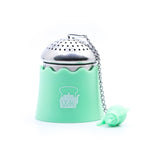 The Whistling Kettle "The Egg" Stainless Steel Tea Ball Infuser with Drip Tray in green.