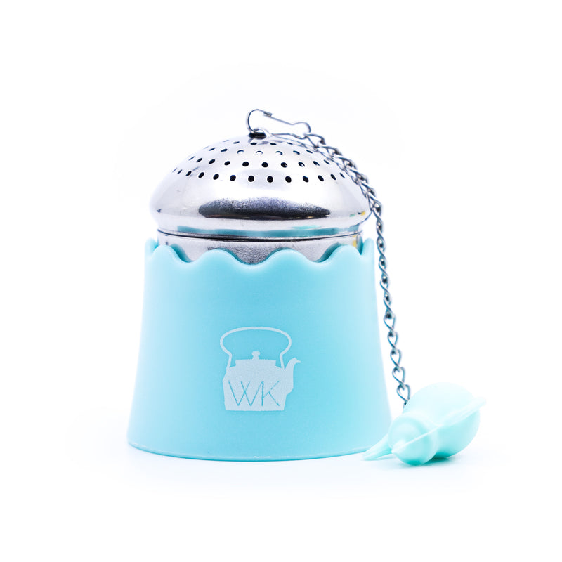 The Whistling Kettle "The Egg" Stainless Steel Tea Ball Infuser with Drip Tray in blue.