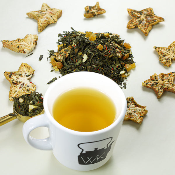 Golden Starfruit tea next to mound of Golden Starfruit loose leaf tea. 