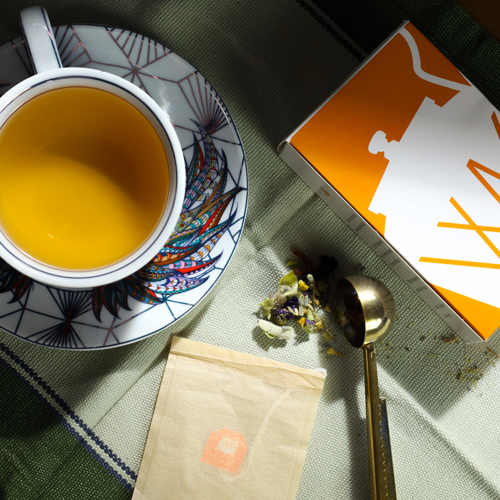 Cup & Saucer set filled with brewed Greek Mountain Meadow tea.