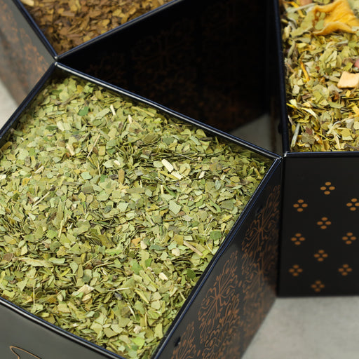 Tea Tin filled with Green Yerba Mate tea leaves.