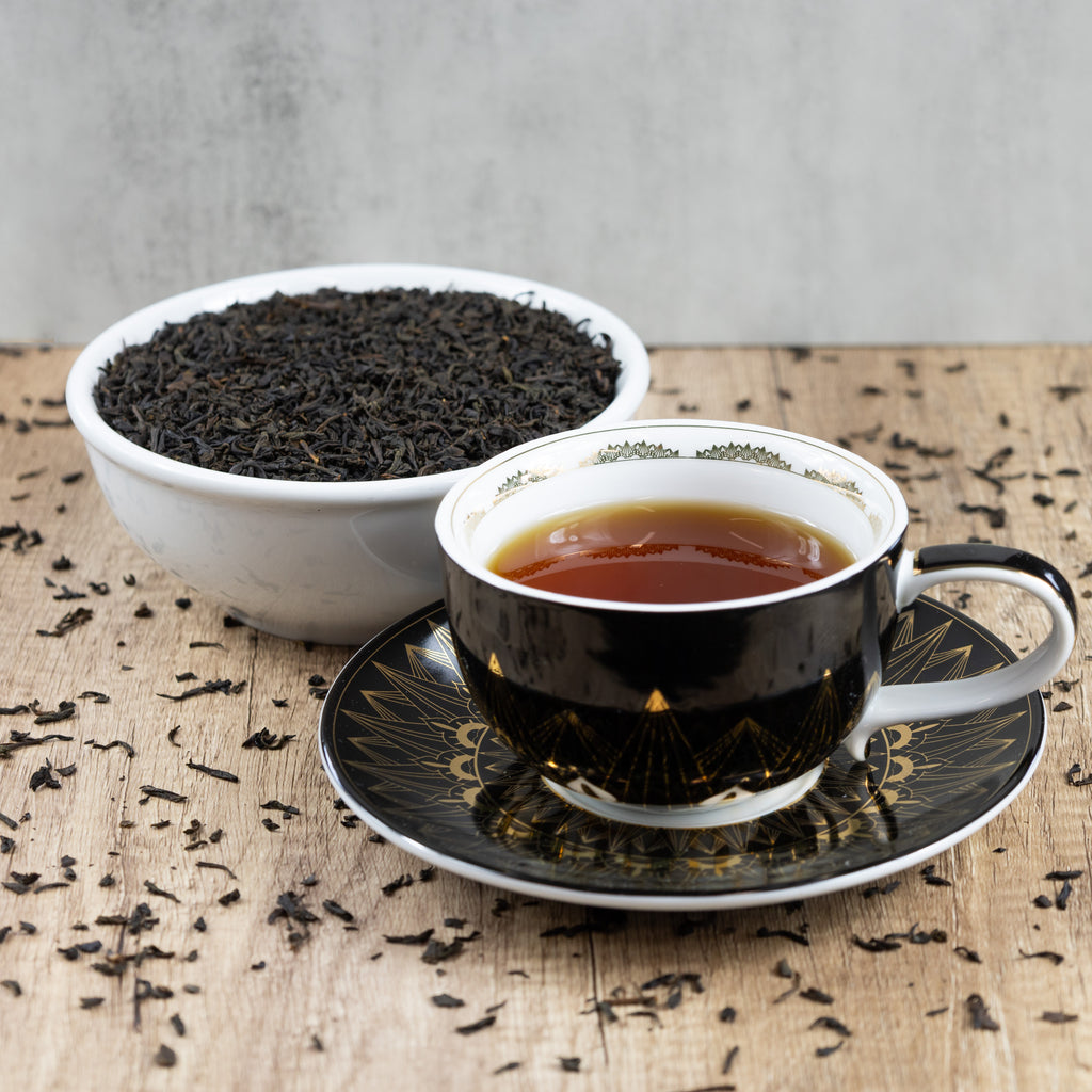 Lapsang Souchong tea leaves and drink
