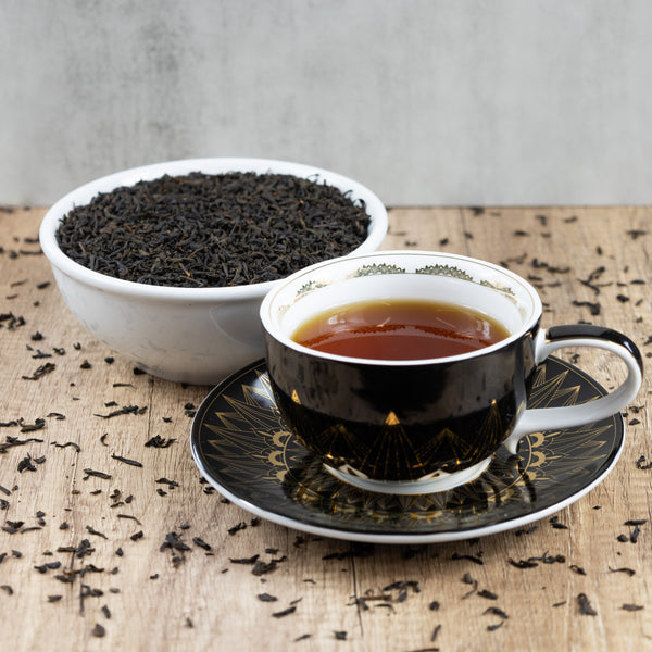 Lapsang Souchong tea leaves and drink
