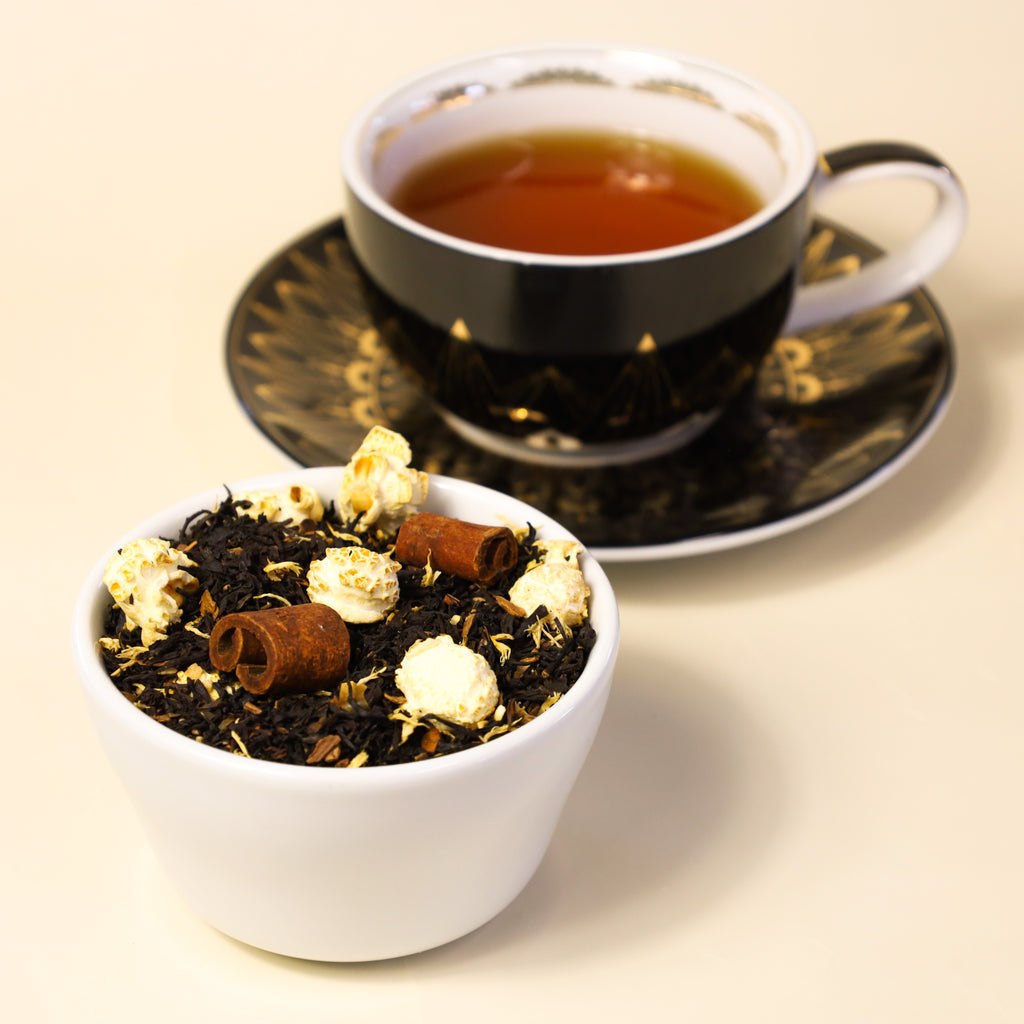 Bowl of Maple Taffy loose leaf tea next to Cup & Saucer filled with Maple Taffy.