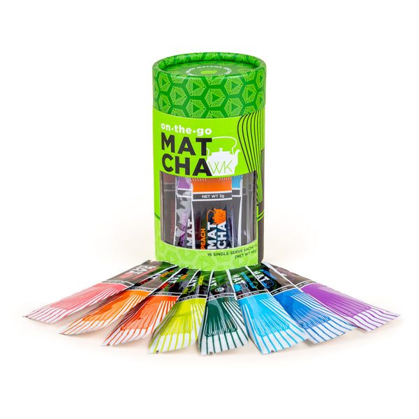 A green cylindrical package of on-the-go matcha sachets, with several individual colorful packets fanned out in front on a white background
