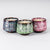 Three marbled tea cups in blue, green, and pink colorways sit in a group against a white background