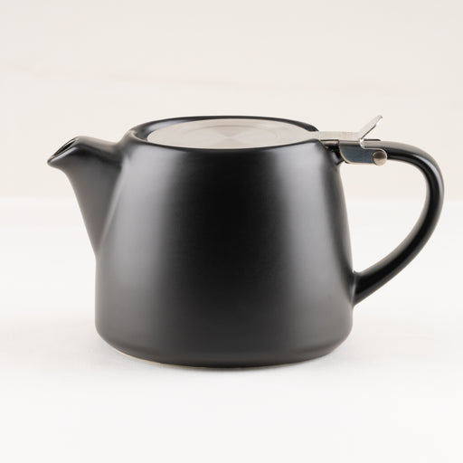 Black teapot with a lid on a white background.