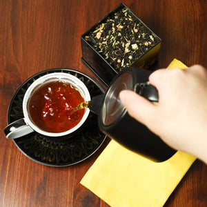 Pouring brewed Pumpkin Chai into Cup & Saucer set.