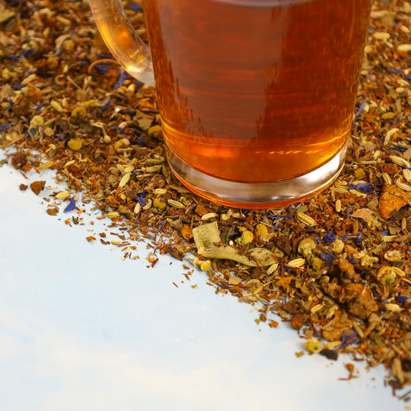 Glass of Seaside tea on top of a mound of Seaside tea leaves.