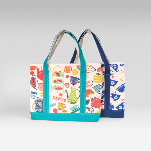 Two canvas tote bag designs displayed together, featuring colorful tea-themed prints with teal and navy accents