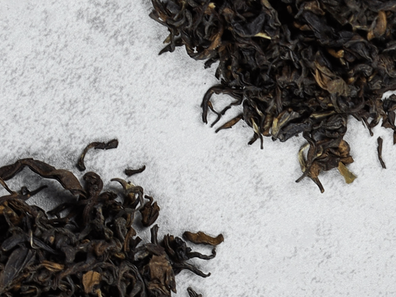Two piles of loose leaf tea