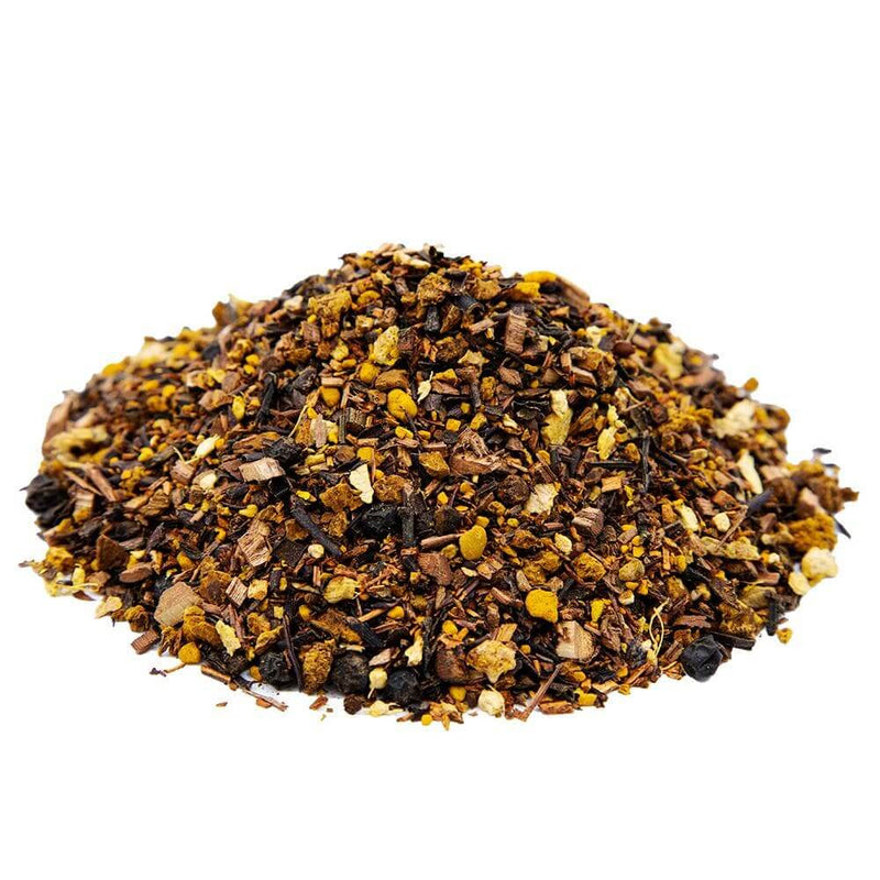 Side mound picture of The Whistling Kettle Comfort Chaga tea with chaga mushroom pieces, rooibos tea and spice blend including turmeric, ginger, and black pepper.