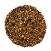 Top mound picture of The Whistling Kettle Comfort Chaga tea with chaga mushroom pieces, rooibos tea and spice blend including turmeric, ginger, and black pepper.