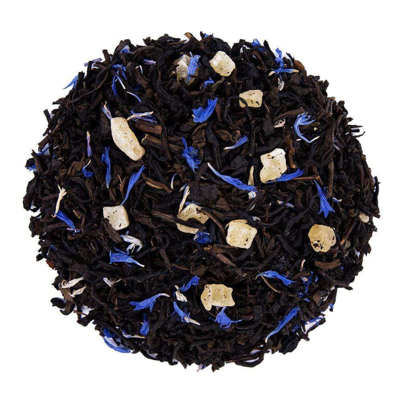 Top mound picture of The Whistling Kettle Decaf Blueberry Mango black tea with dried mango, blueberries, and cornflowers.