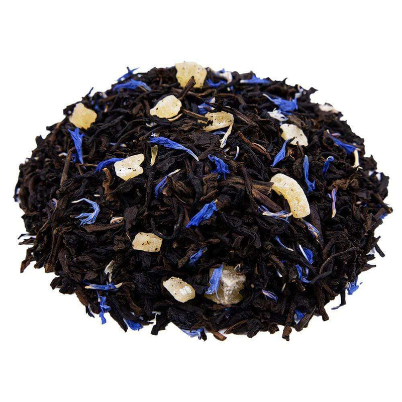 Side mound picture of The Whistling Kettle Decaf Blueberry Mango black tea with dried mango, blueberries, and cornflowers.