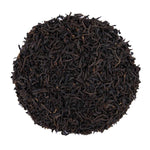 Top mound picture of The Whistling Kettle Keemun Panda black tea leaves.