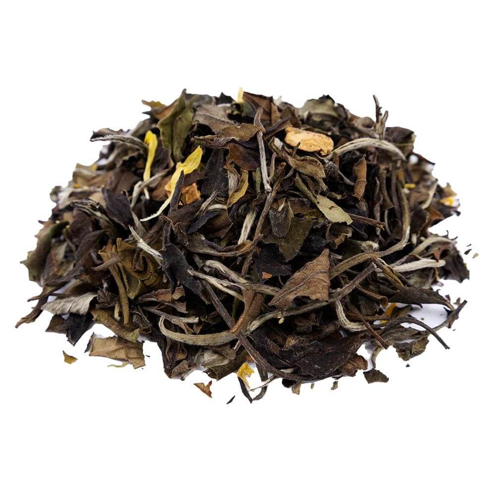Side mound picture of The Whistling Kettle Mango Pear white tea with dried fruits.