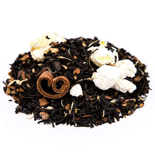 Side mound picture of The Whistling Kettle Maple Taffy black tea with popcorn kernels, cinnamon sticks, and maple bits.