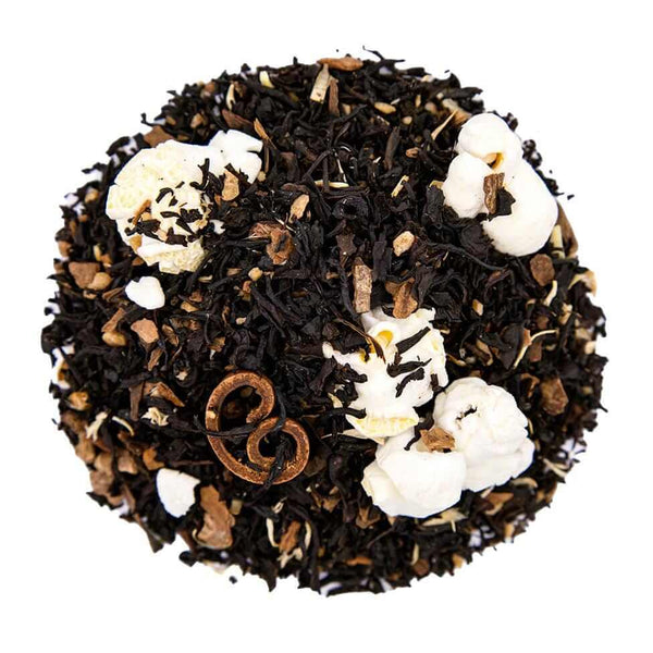 Top mound picture of The Whistling Kettle Maple Taffy black tea with popcorn kernels, cinnamon sticks, and maple bits.