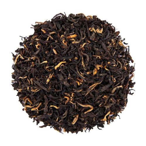 Top mound picture of The Whistling Kettle Mokalbari East Assam black tea with golden tips.