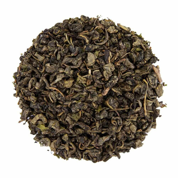 Top mound picture of The Whistling Kettle Moroccan Mint green tea with mint leaves.