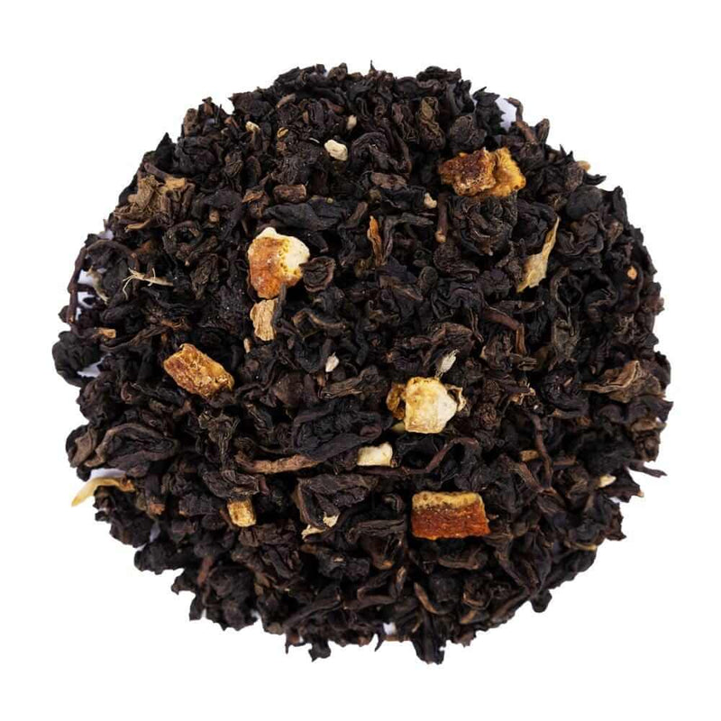 Top mound picture of The Whistling Kettle Orange Ginger Oolong tea with dried orange peel and ginger root.