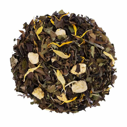 Top mound picture of The Whistling Kettle Peach White tea with flower petals and dried fruit.