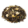 Side mound picture of The Whistling Kettle Peach White tea with flower petals and dried fruit.