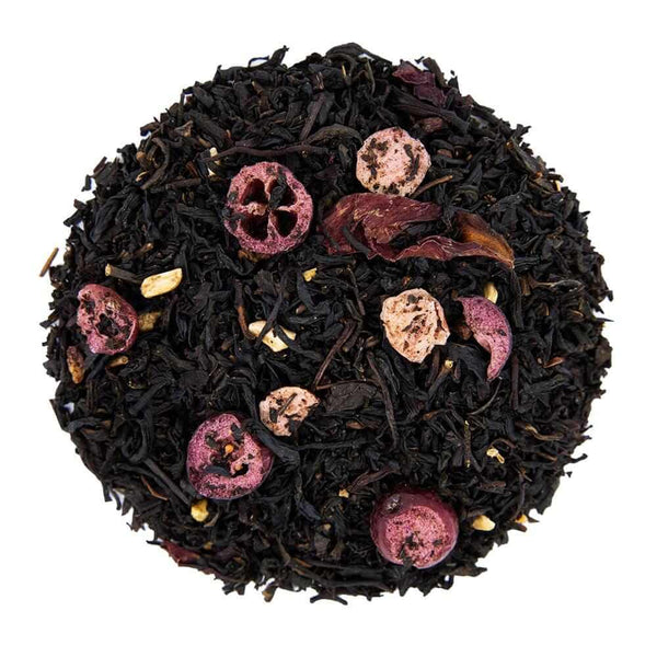 Top mound picture of The Whistling Kettle Pomegranate Cranberry tea with dried cranberry, raspberry, pomegranate, and rose petals.