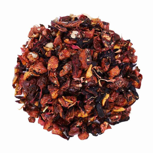 Top mound picture of The Whistling Kettle Strawberry Watermelon loose leaf tea with dried berries, apple, hibiscus, and rose hips.