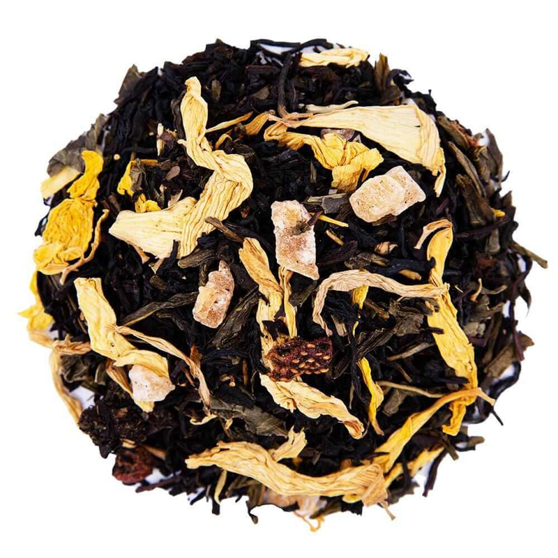Top mound shot of The Whistling Kettle's Midsummer Night's Dream black and green tea with pineapple, papaya, sunflower petals.